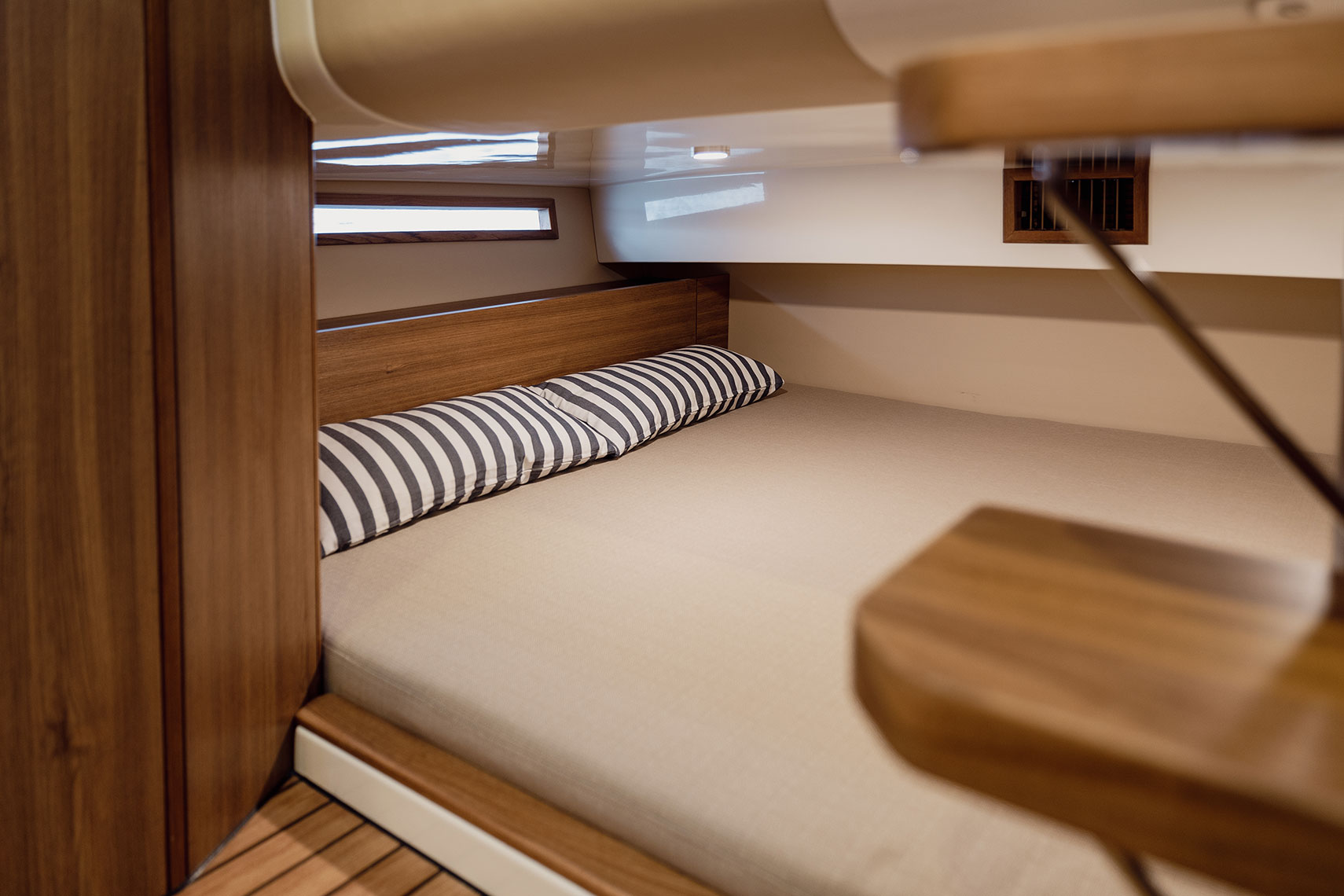 Double bed below the stern.